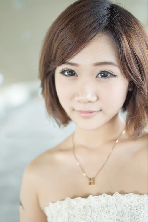 Cute Short Haircut with Side Swept Bangs for