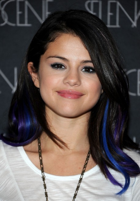 Hairstyle with vibrant blue and violet streaks