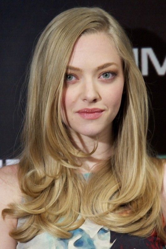 Long blonde side parting hairstyle