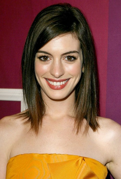 Long Bob (lob) hairstyle with side swept bangs for oval face shapes
