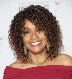 Medium Curly Hairstyle for women over 50s Medium Curly Hairstyle for women over 50s