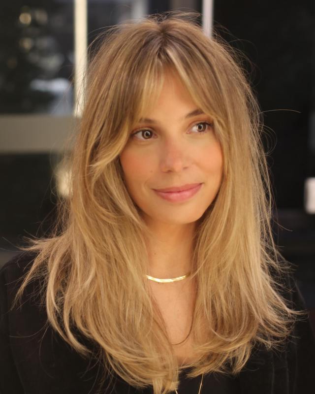 Medium Shag hair with curtain bangs