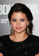 Simple Easy Side Loose Bun Updo from Selena Gomez  Selena Gomez Simple Easy Side Loose Bun Updo