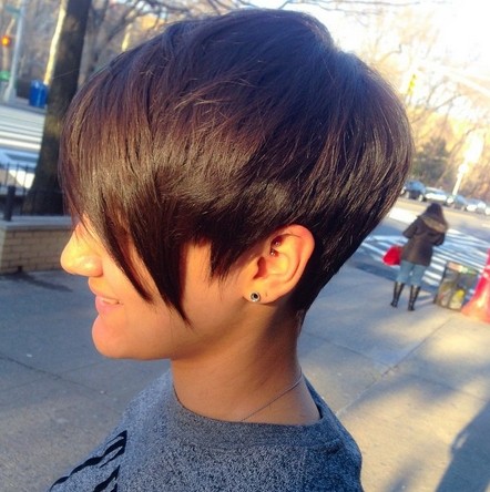 Short dark pixie haircut with long bangs for fine thick hair